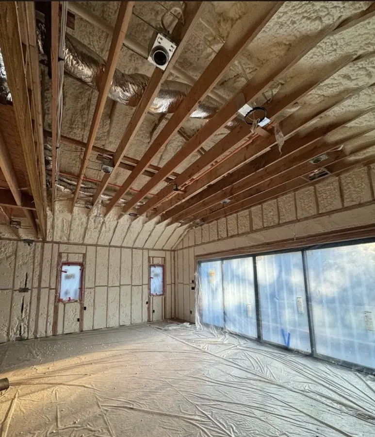 Interior walls and ceiling insulated with spray foam during new construction in St. Louis Park